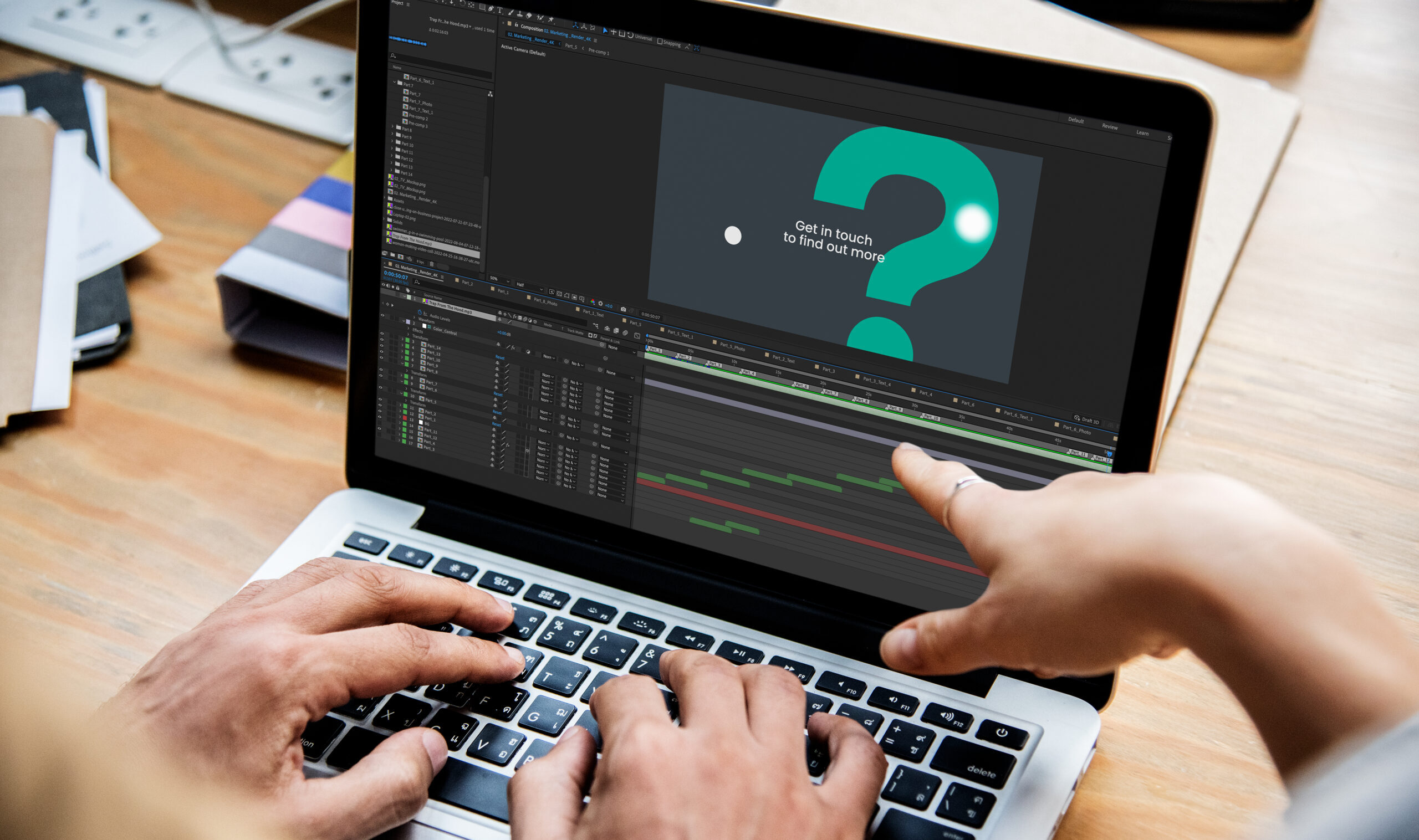 Two people revewing a video shown in after effects