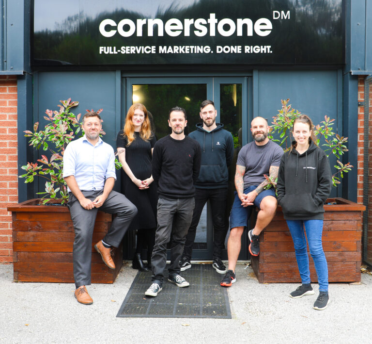 New recruits stood outside of Cornerstone's Oldham offices. Left to right: Jamie Smith (Business Development Manager), Abigail Tomlinson (Senior Account Manager), Phil Owen (Technical Lead), Josh Tomlinson (Web Project Manager), Steve Perry (Senior Web Developer), Hannah Jones (Junior Web Developer)