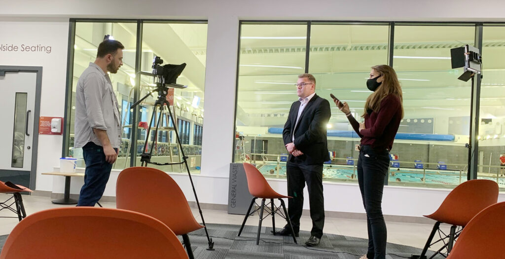 Video shoot showing the recording of a CEO at a leisure centre near the poolside